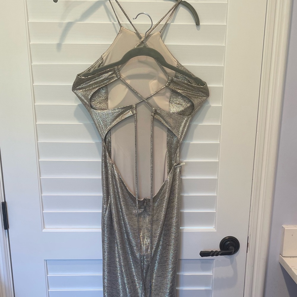 Gold halter top prom dress with open back from Von Maur